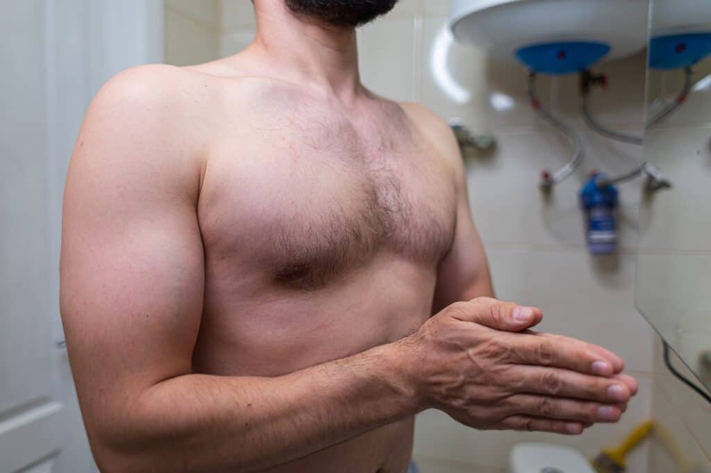 man naked in the bathroom close up