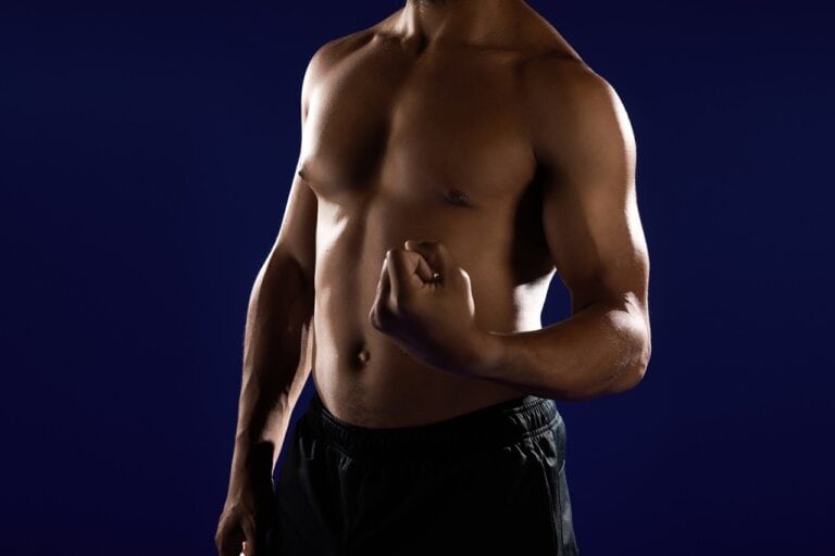 black muscular man shirtless flexing