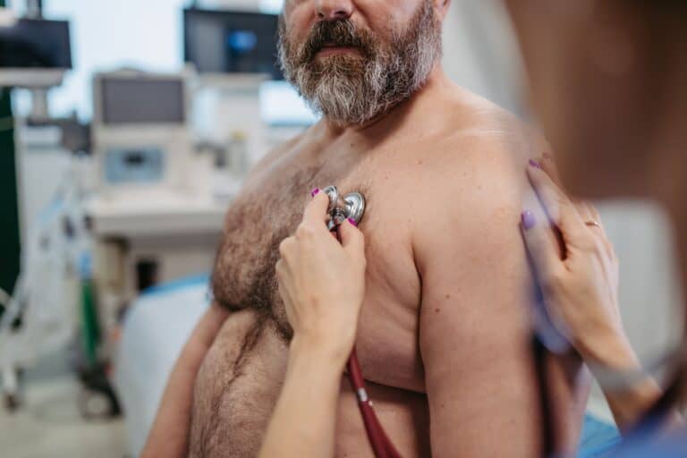 adult male checked by doctor