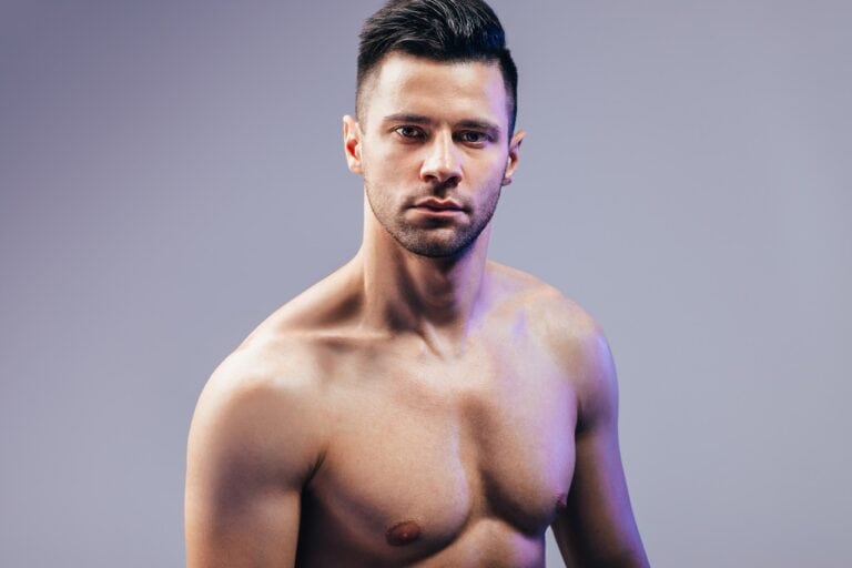 man with clean haircut staring back
